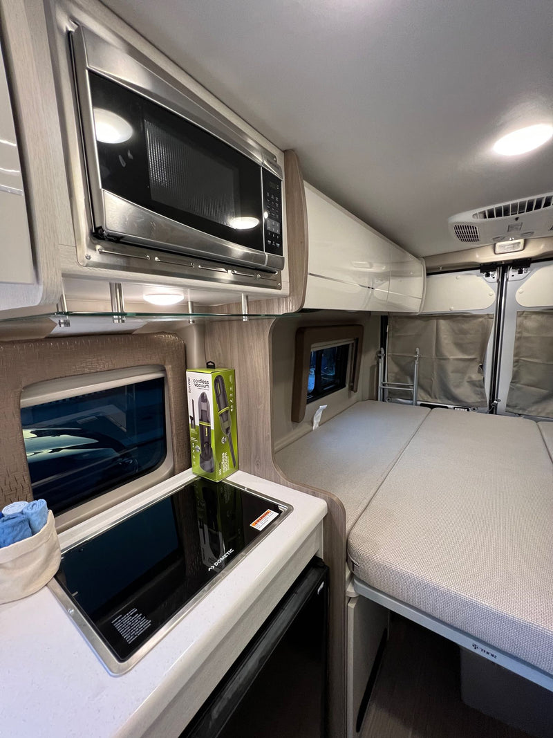  and modern mobile living setup. Ready for adventure!|Rear view of a silver Thor Tellaro camper van from La Mesa RV — photo 12