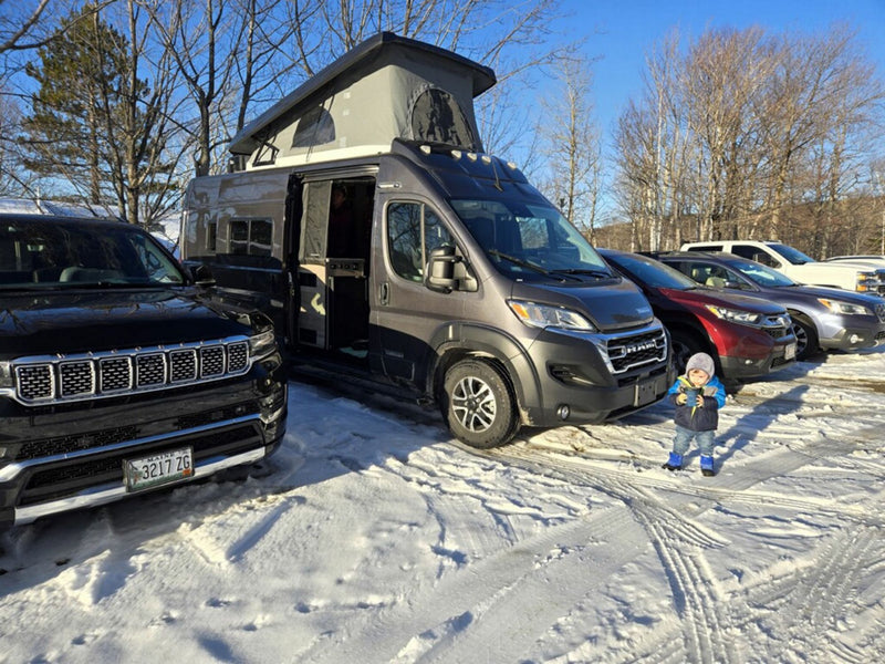  offering stunning coastal views for road trip fun.|Compact rv rental camper van interior with kitchen — photo 4