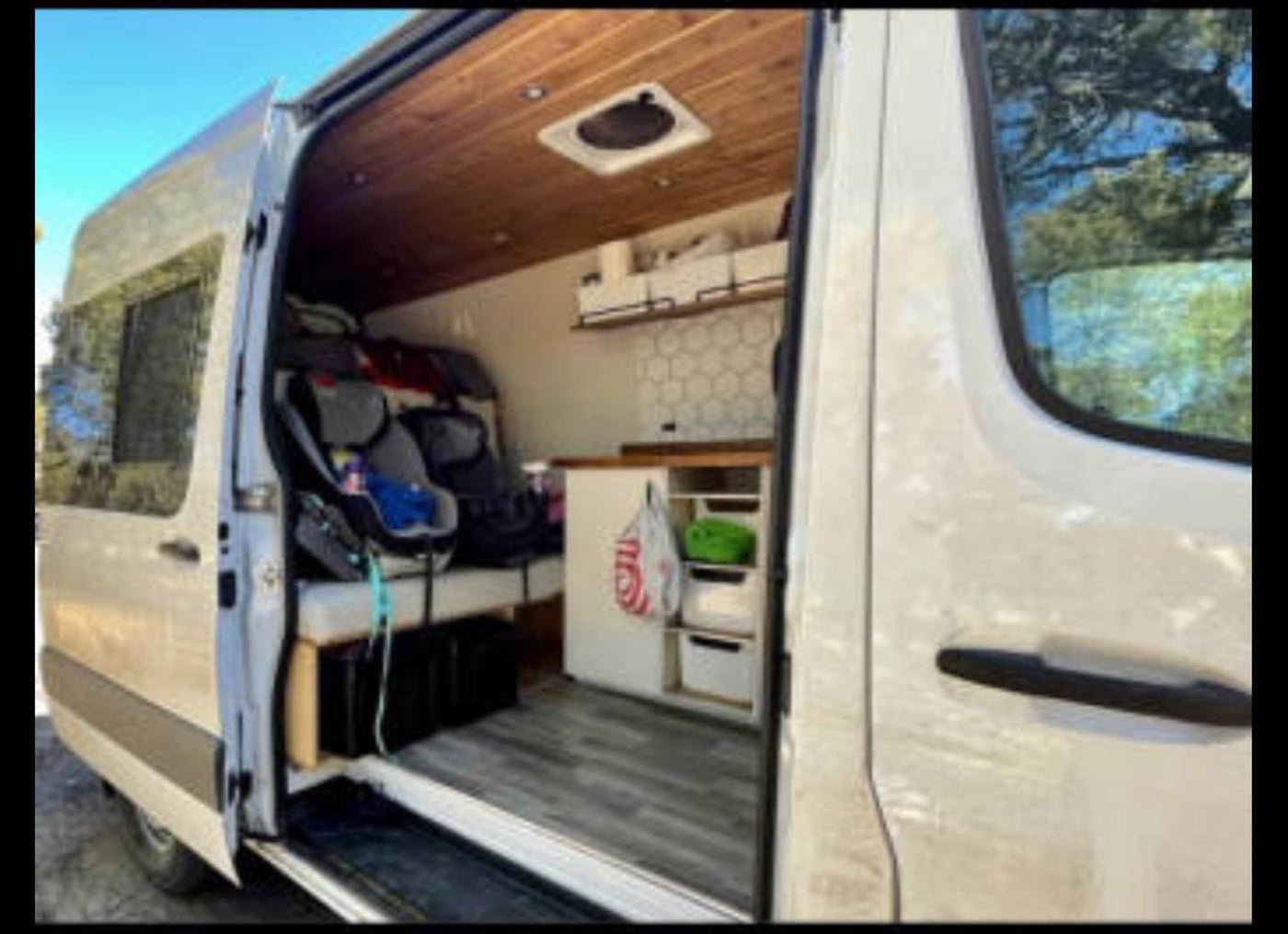  and sleek kitchenette.|Modern rv rental interior featuring bunk beds — photo 7