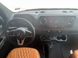 Mercedes-Benz RV rental interior: Modern dashboard, steering wheel, infotainment, and quilted seats for a comfortable journey.