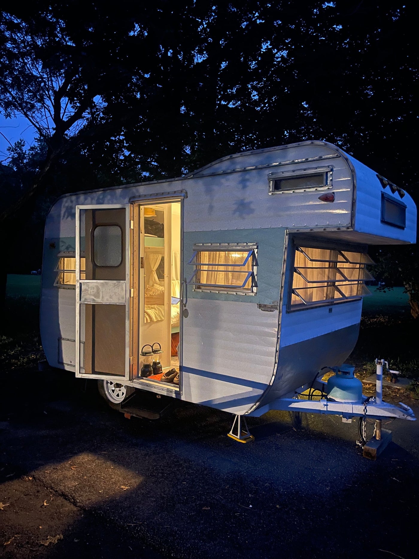  and scenic window views.|Cozy RV rental interior: vintage kitchen with teal accents — photo 20