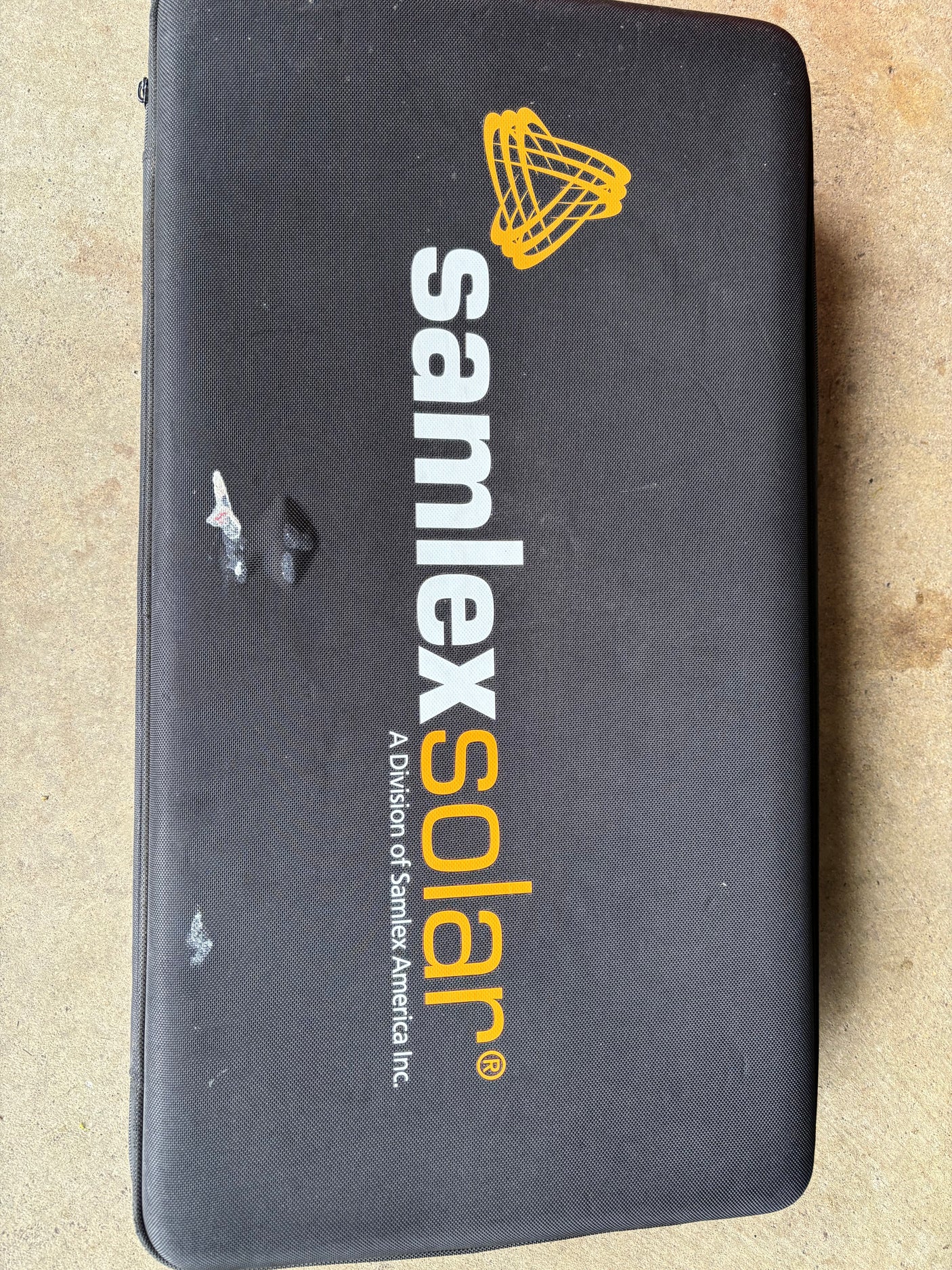 Black SamlexSolar portable solar panel case, ideal for charging needs with an RV rental.