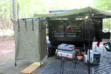 Campsite ready! This overlanding trailer, with an awning, shower tent, and camp gear, is ideal for an RV rental.