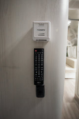 Control your comfort in this rv rental with the Dometic thermostat and LG remote mounted on the wall.