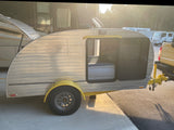  offering fresh air.|Cozy RV rental sleeping area with an inflatable air mattress & white-wrapped pillows