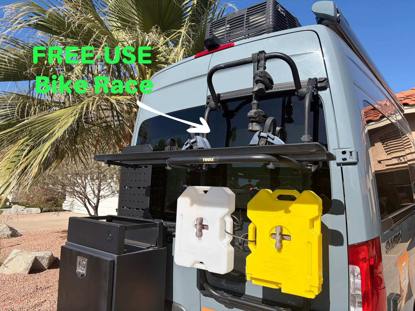 RV rental van with Thule bike rack for "FREE USE Bike Race," Rotopax containers, and storage. Ready for adventure!