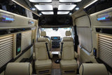 Luxurious RV rental interior with cream leather seats, ambient lighting, and entertainment system. Perfect for travel comfort.