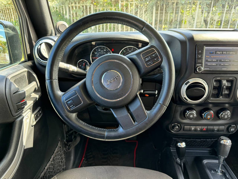 Experience the road! Jeep interior with dashboard and steering wheel, ideal for exploring alongside your RV rental. — photo 15