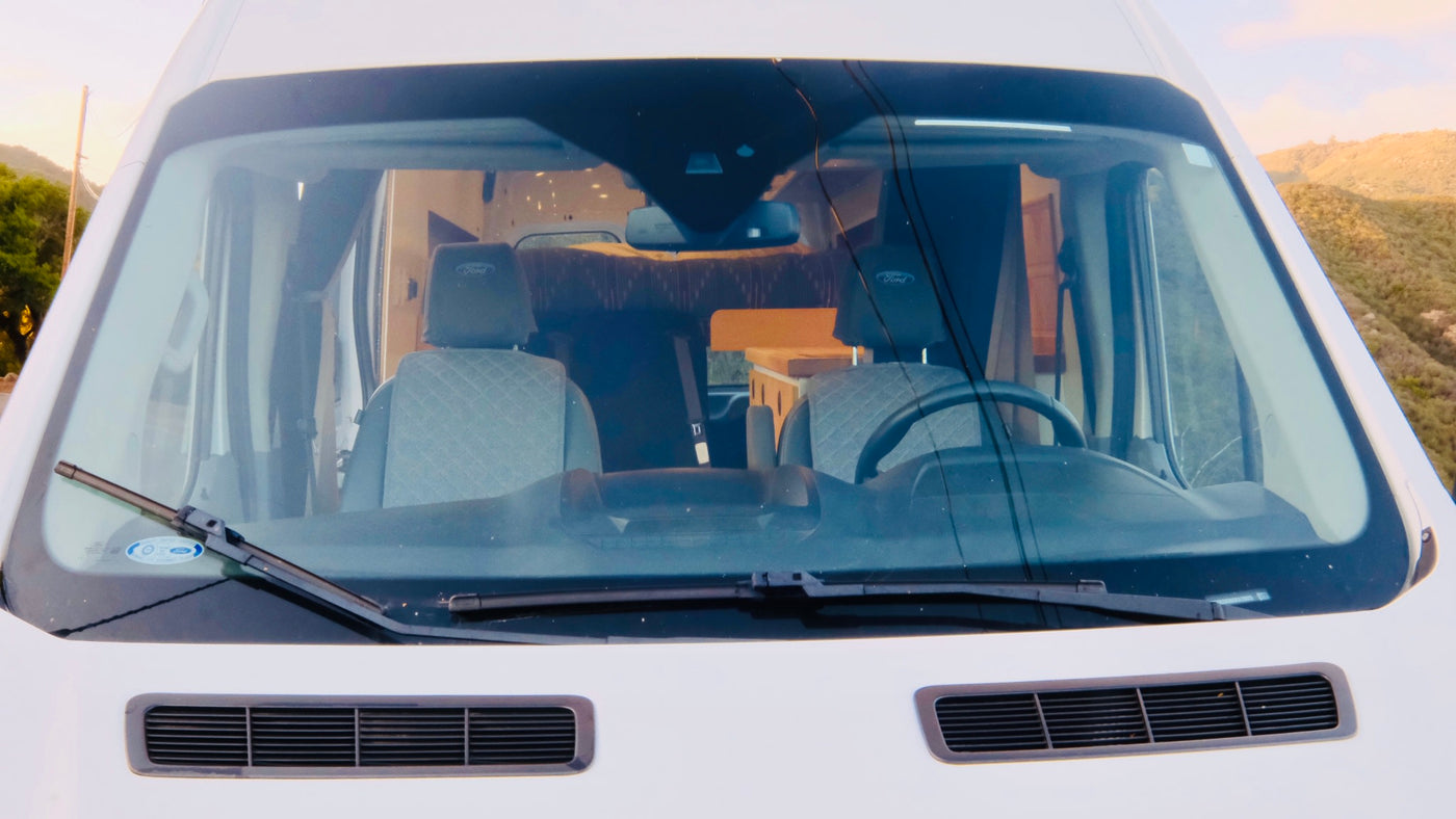  and front cabin views.|Cozy rv rental interior featuring a wood ceiling — photo 10