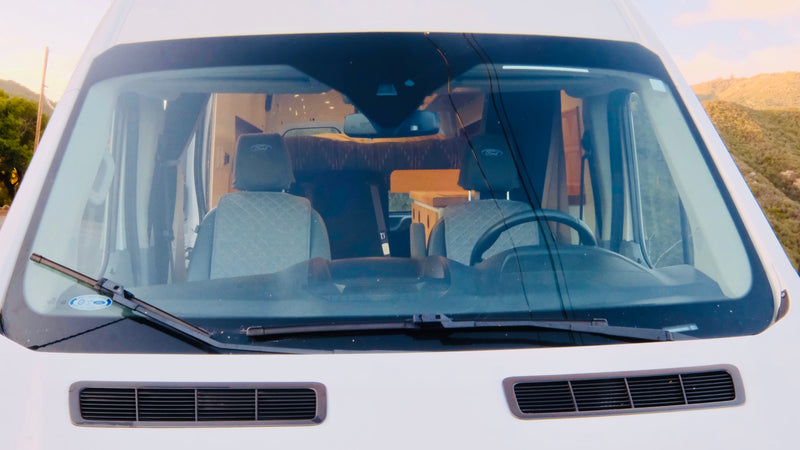  and front cabin views.|Cozy rv rental interior featuring a wood ceiling — photo 10