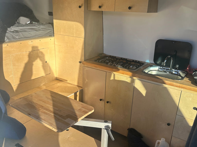  viewed from a cozy RV rental.|Compact RV rental kitchen — photo 6