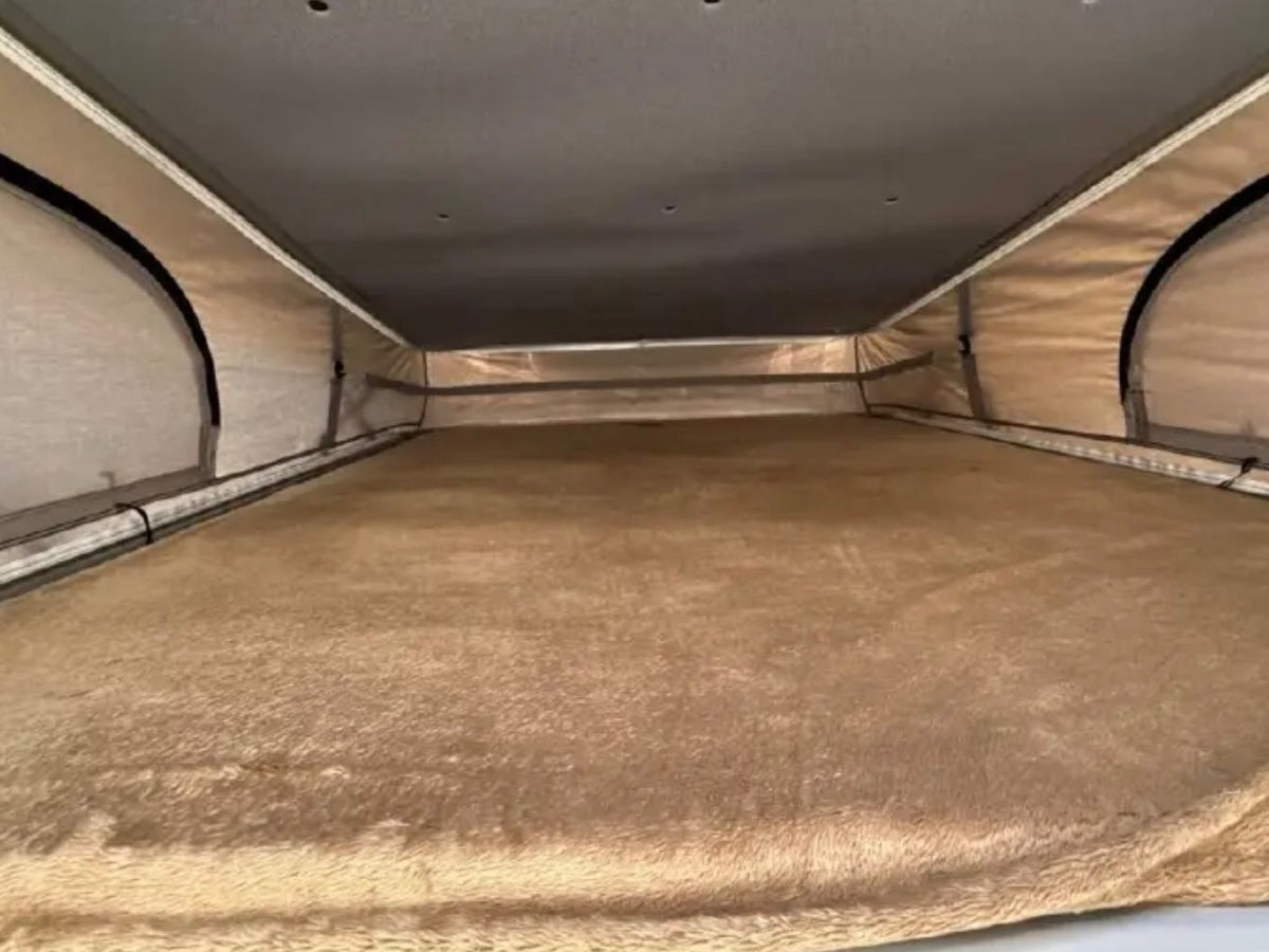  and a chrome shower fixture above.|RV rental interior: A compact Dometic kitchen — photo 9