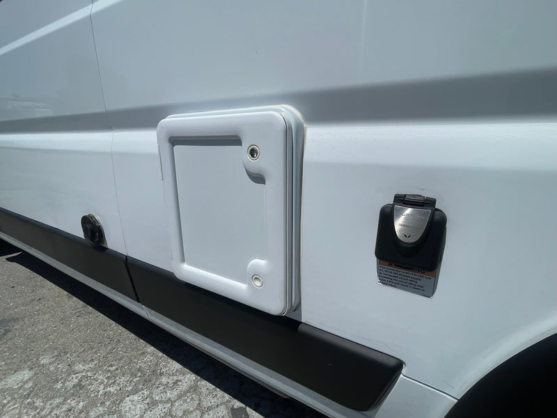  and storage. Enjoy scenic views from this compact camper van.|Compact rv rental bathroom: white molded shower stall with toilet — photo 9
