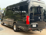 This black Mercedes-Benz Sprinter 'Ultimate Toys' luxury RV rental van boasts dually wheels & rear hookups.
