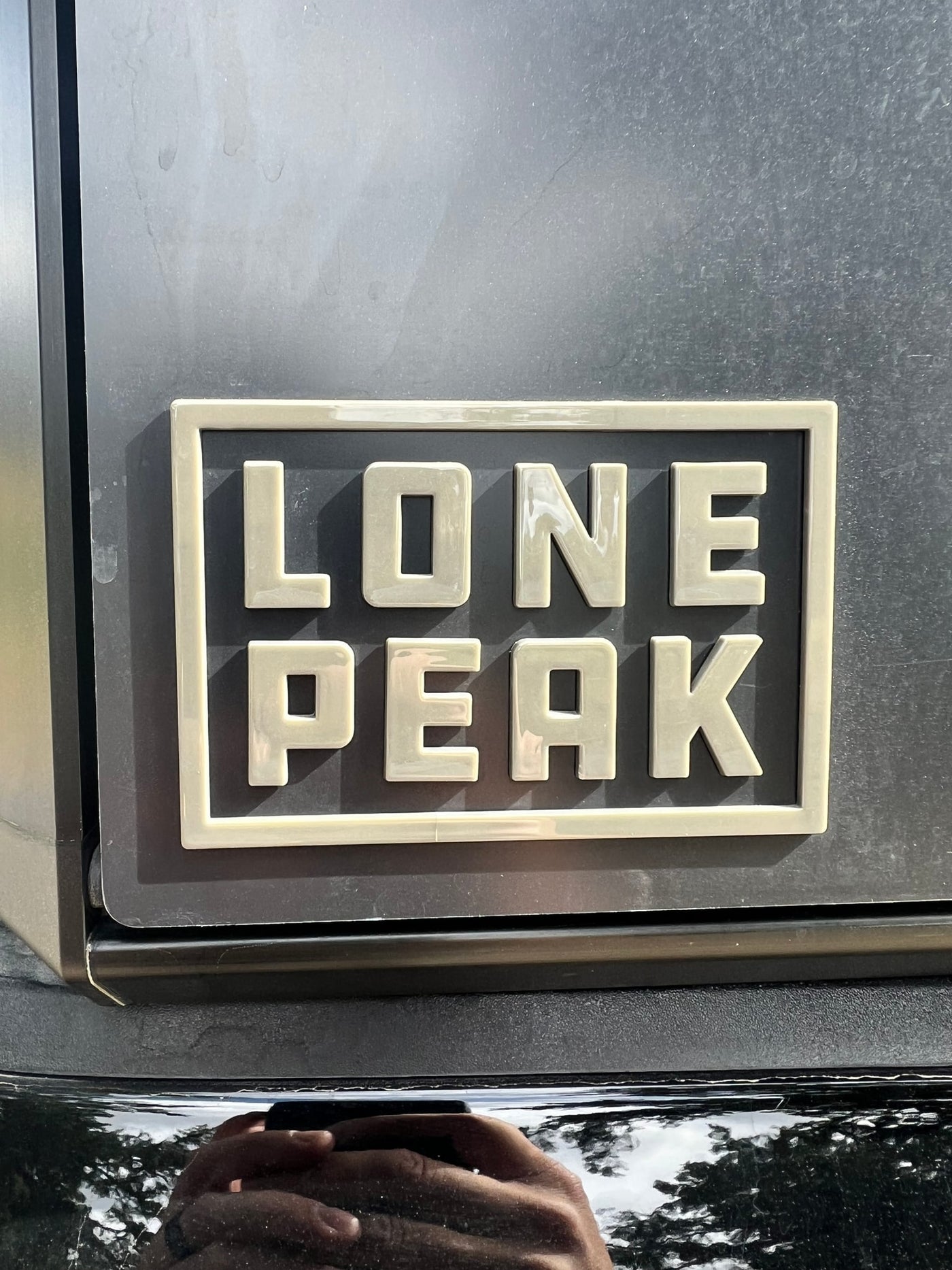Durable "Lone Peak" emblem on an RV rental, hinting at scenic mountain journeys. — photo 19