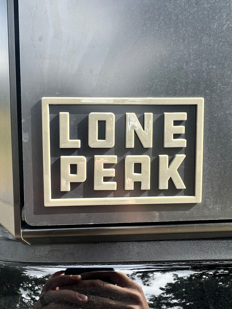 Durable "Lone Peak" emblem on an RV rental, hinting at scenic mountain journeys. — photo 19