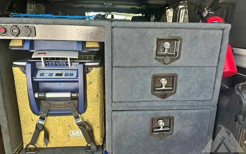 Freezer with enclosure and drawers