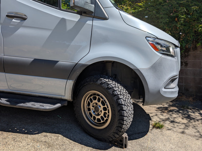  equipped with rugged off-road tires and bronze aftermarket wheels — photo 3
