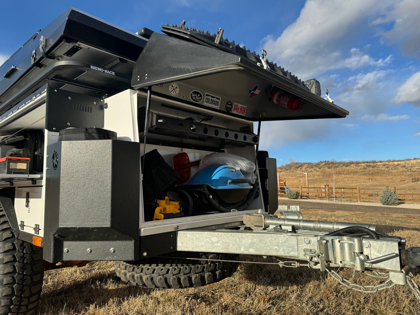 RV rental: Adventure-ready off-road camper trailer with open storage revealing gear. Perfect for outdoor exploration. — photo 3