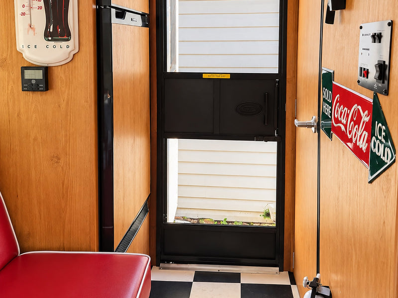  and diner-style seats.|A retro Coca-Cola themed kitchenette in an RV rental — photo 8