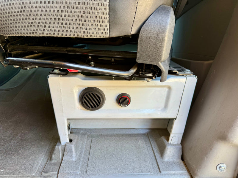 An auxiliary Webasto heater and vent system, mounted under a seat in an rv rental, providing vehicle interior climate control. — photo 19