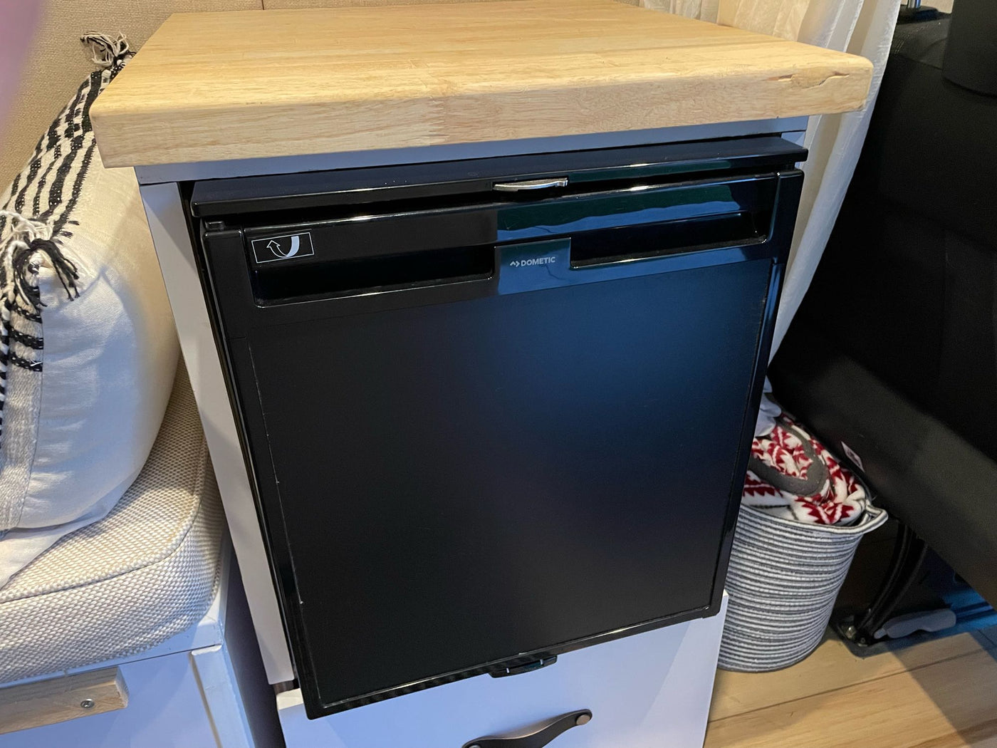 Built-in Dometic refrigerator and wooden countertop in a functional RV rental setup. — photo 15