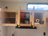  engrossed in reading books inside the cozy camper.|RV rental interior featuring a cozy loft bed