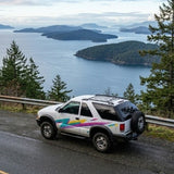 This classic SUV, an ideal travel companion, offers stunning island views from a coastal road. Consider an rv rental for similar adventures.