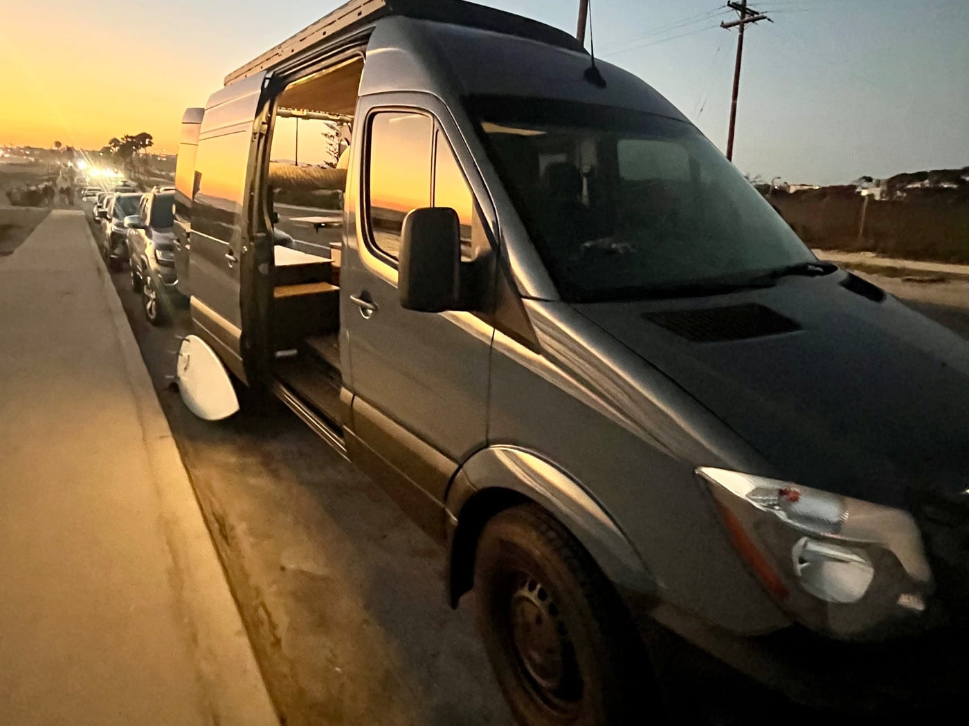  and swiveling front seats.|Dark grey Sprinter camper van — photo 4