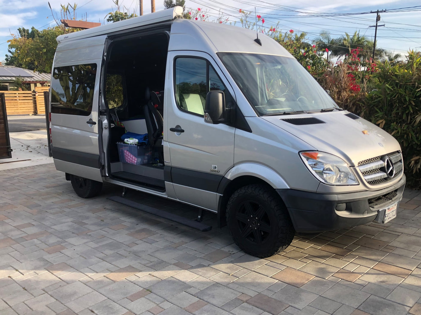  and overhead cabinets.|Happy kids on bunk beds in their RV rental camper van. Ready for family adventures!|Inside an RV rental: view of rear seats