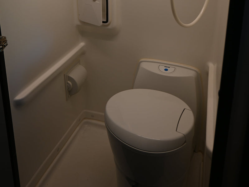  and a fire extinguisher for safety.|Cozy RV rental bed with pillows — photo 12