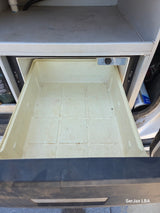An empty Dometic refrigerator drawer in an rv rental, offering clean, accessible storage for your road trip essentials.