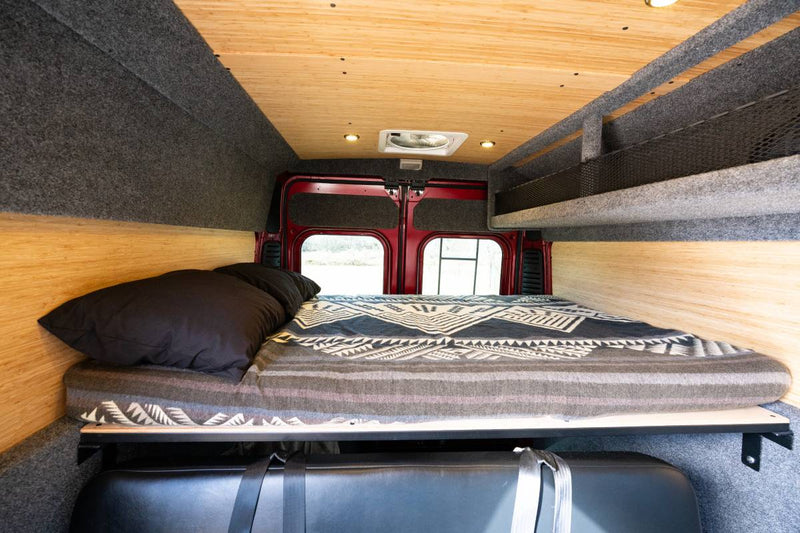  and front seats. Ready for your adventure.|Rear view of a red rv rental camper van with open doors — photo 6