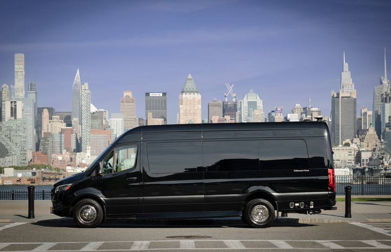  parked before a stunning city skyline.|Sleek black Mercedes-Benz Sprinter RV rental parked with a vibrant NYC skyline background. Ideal for luxury travel.|Cream-colored — photo 2