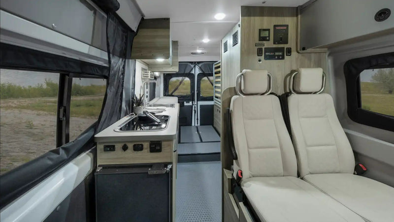  parked at a forest campsite. Perfect for your next RV rental adventure.|White RV rental with pop-top parked on a road in Yosemite National Park — photo 3