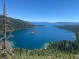 Scenic Emerald Bay, Lake Tahoe. Clear blue water, forested shores, and boats. Ideal for an RV rental trip.