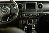 Jeep interior: steering wheel, gauges showing "Brake + Press Brake," & climate/drive controls. Great for an RV rental.