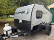 A compact gray & black Clipper travel trailer