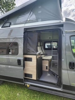  ideal for travel.|Compact **rv rental** interior: a foldable slatted bed — photo 17