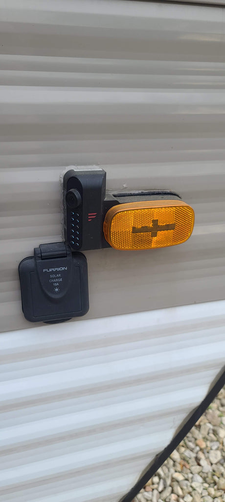 RV rental: Furrion rear observation camera and 10A solar charge port for enhanced safety and power management.