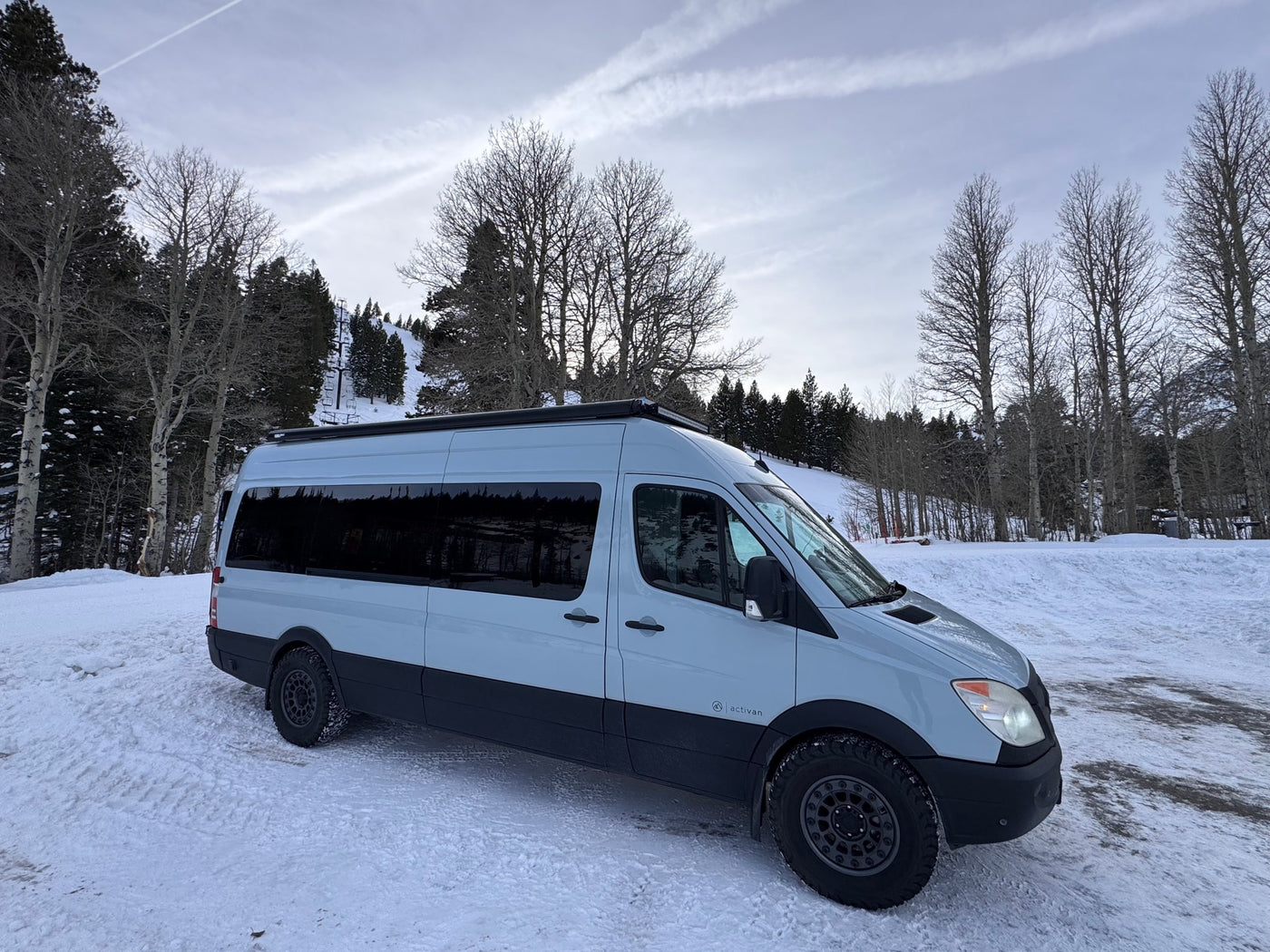  and a crescent moon.|Light grey camper van — photo 19