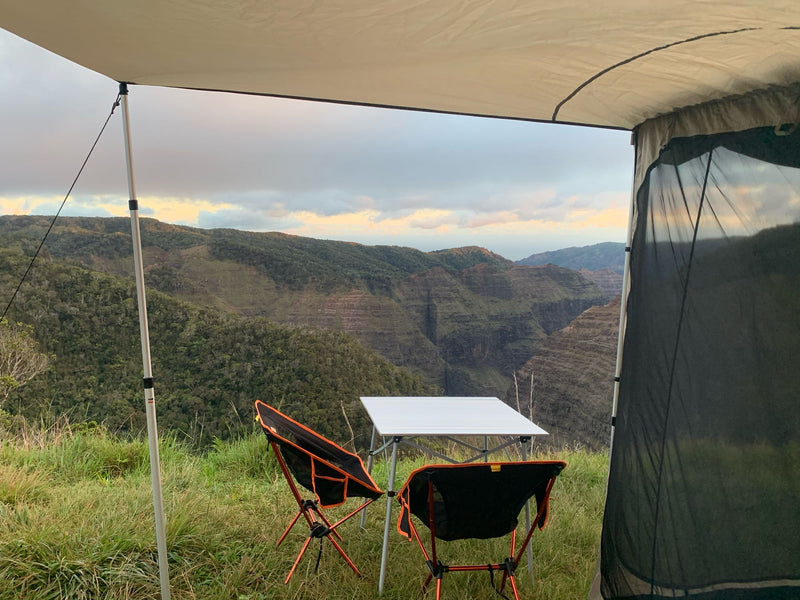  person inside.|Overland SUV camping setup with attached tent — photo 8