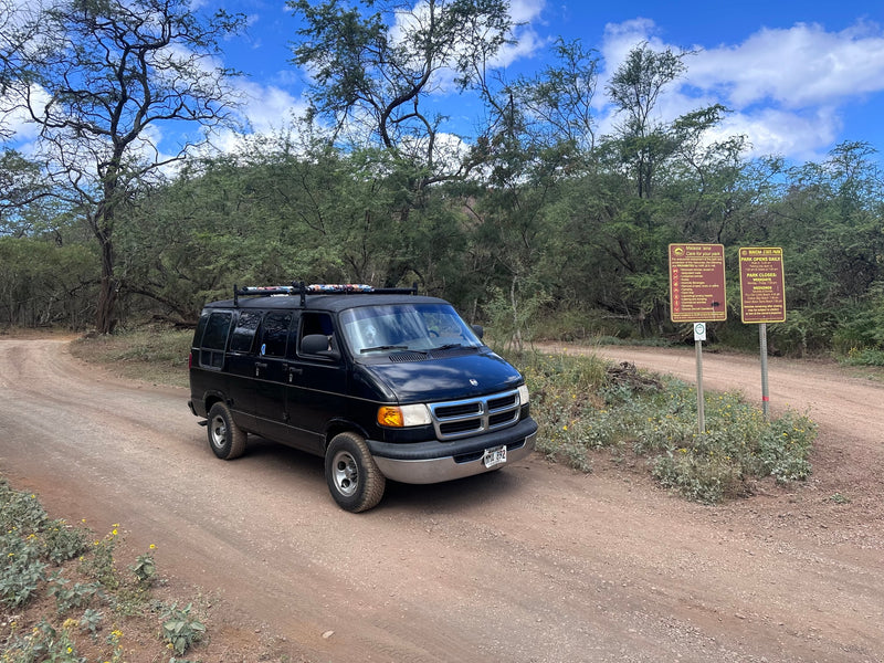  parked outdoors. Your next rv rental for adventure!|Explore with an RV rental! Camper van with surfboard — photo 3