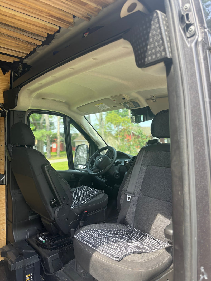  dark grey Ram ProMaster van parked on a gravel driveway — photo 9