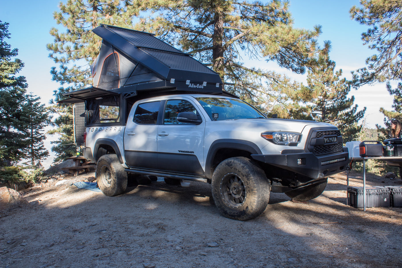 Explore the wilderness in this rugged RV rental: a white Toyota Tacoma overland truck with a rooftop tent, ideal for camping. — photo 5