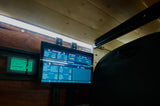An RV rental's Victron display monitors solar, battery, and water levels, showing vital stats for an off-grid journey.