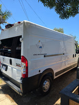 Custom white Ram ProMaster van conversion, branded 'The White Wanderer,' ideal for an RV rental adventure.