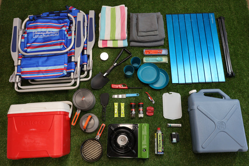 RV rental prep: camping gear laid out on grass - cooler, stove, chairs, table, cookware, water jug. All essentials. — photo 2