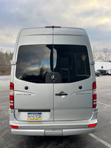 Silver Airstream Interstate RV rental van (Mercedes-Benz Sprinter) from rear. PA 'MOTOR HOME' plate visible.