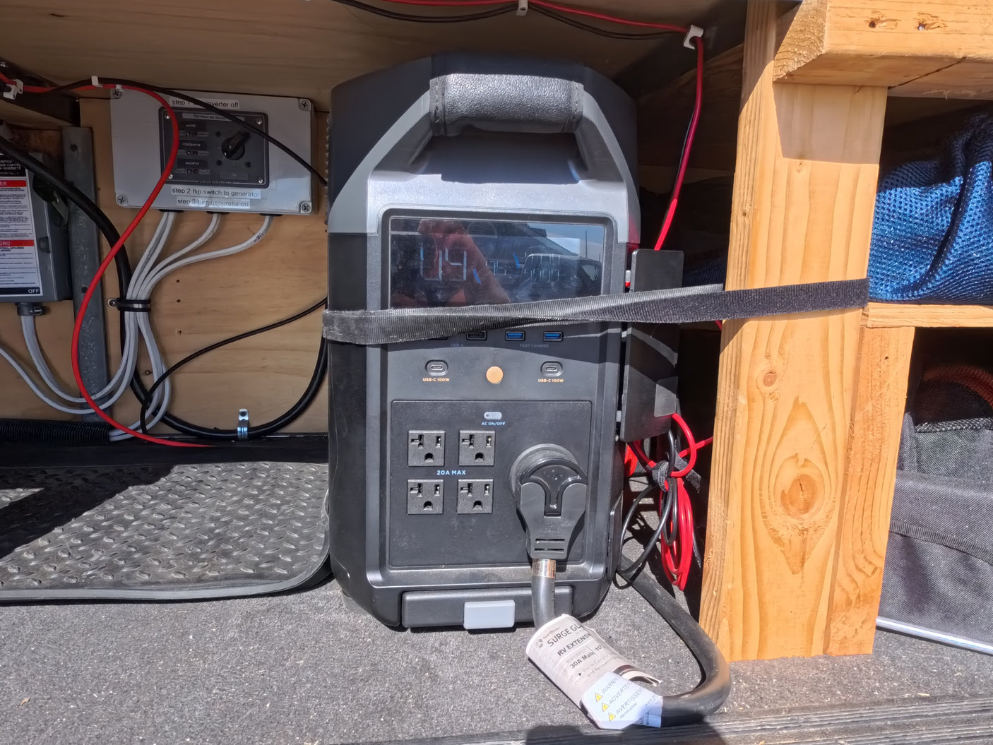 Portable power station and generator switch setup in an RV rental. Essential electrical management for off-grid adventures.